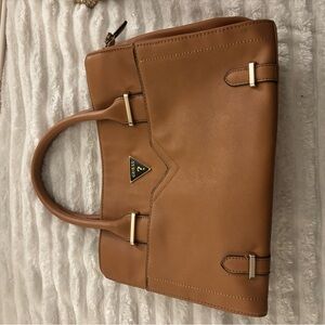 Guess Alexie Girlfriend satchel handbag in light cognac or brown faux leather.